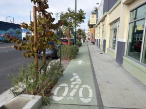 photo of Mission Blvd sidewalk level protected bikeway in Hayward