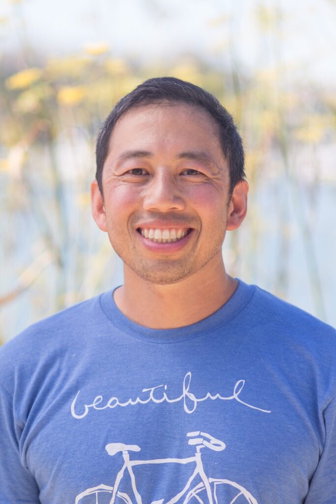A close-up portrait of Phil Yip of Bike East Bay