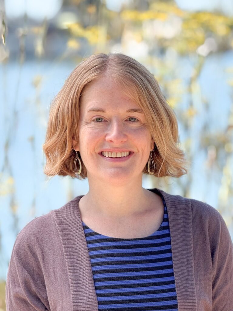 A close-up portrait of Bike East Bay staff member Rebecca Saltzman